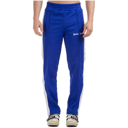 PALM ANGELS TAPED TRACK PANTS IN BLUE/WHITE